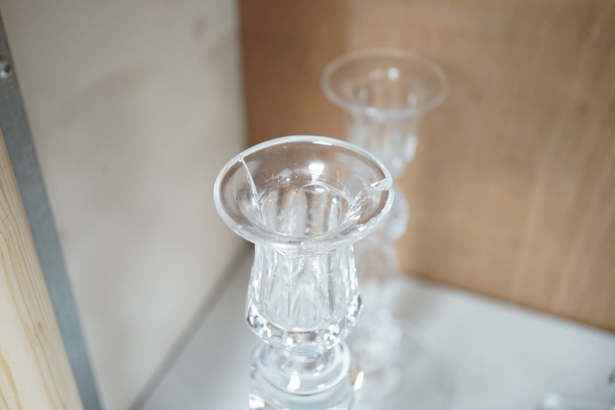 Five various cut glass candlesticks, a pair of John Ford, Holyrood Glass Works, Edinburgh figural frosted glass candlesticks and a lustre drop bag chandelier